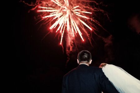 Newlyweds background fireworks at their wedding dayの写真素材