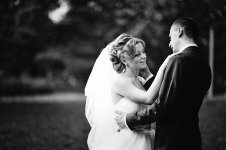Young and gorgeus wedding couple on autumn forest