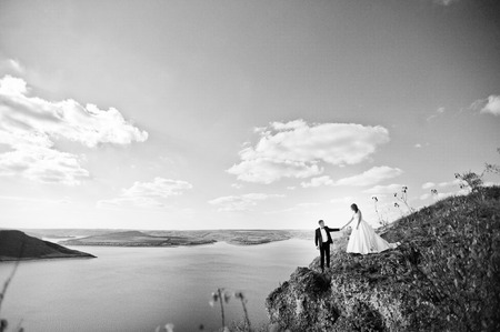 Very sensual and gorgeus wedding couple on the picturesque landscapesの写真素材