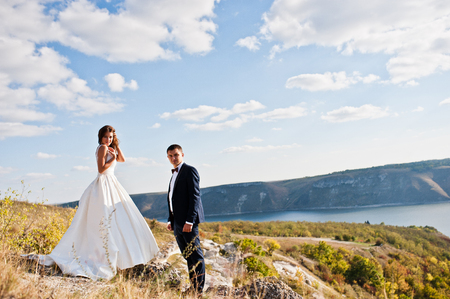 Very sensual and gorgeus wedding couple on the picturesque landscapesの写真素材