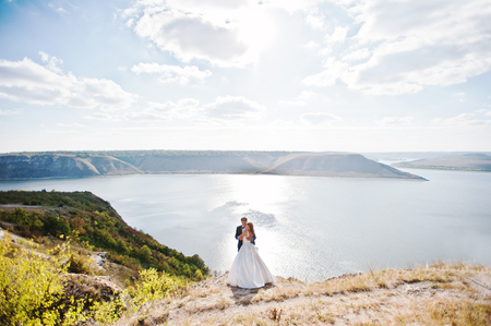 Very sensual and gorgeus wedding couple on the picturesque landscapesの写真素材