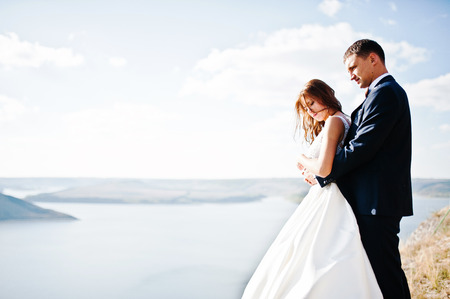 Very sensual and gorgeus wedding couple on the picturesque landscapesの写真素材