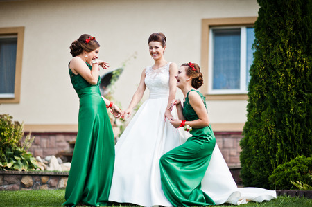 Bride in the courtyard of the mansion house with bridesmaidsの写真素材