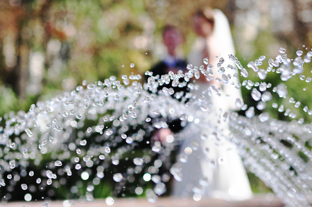 Drops fountain on the background of newlywedsの写真素材