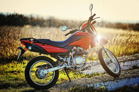 Enduro motorcycle stay on sunset sunshineの写真素材