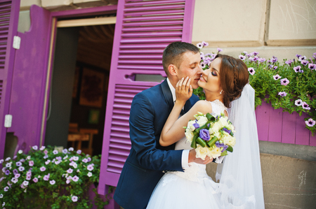 Newlywed with decor violet word love background purple wooden windowの写真素材
