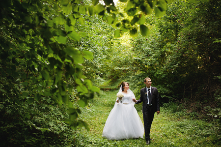 Wedding couple at green alleyの写真素材
