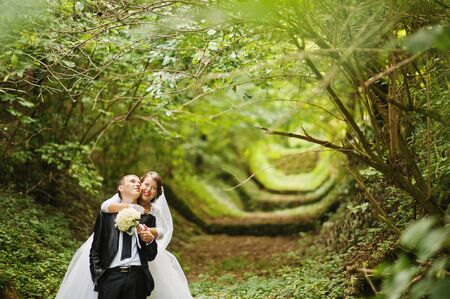 Wedding couple at green alleyの写真素材