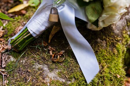 Wedding bouquet with lock at moss