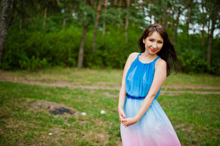 Young beautiful and cute girl posed at pine forestの写真素材