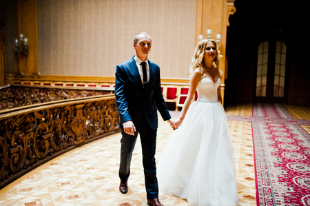 Elegant wedding couple at old vintage house and palace with big wooden stairsの写真素材