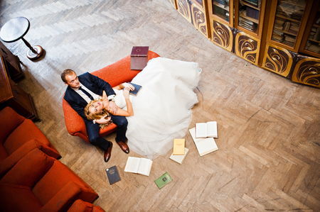 Elegant wedding couple at old libraryの写真素材