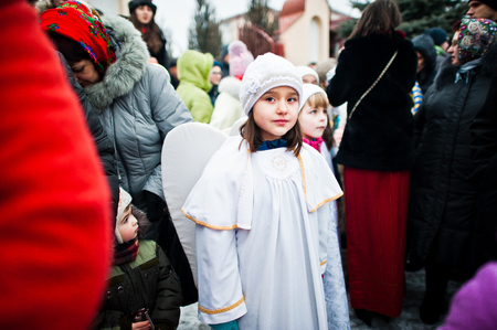 UKRAINE. LVIV - JANUARY 14, 2016: Christmas nativity scene parade of children on winter day.