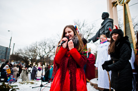 UKRAINE. LVIV - JANUARY 14, 2016: Christmas nativity scene parade of children on winter day.のeditorial素材