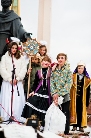 UKRAINE. LVIV - JANUARY 14, 2016: Christmas nativity scene parade of children on winter day.のeditorial素材
