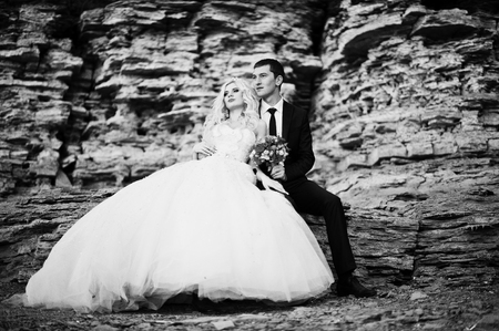 Charming bride and elegant groom on landscapes of mountains and rocksの写真素材