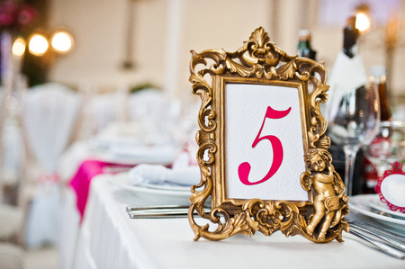 Vintage bronze figure 5 in the frame at the wedding tableの写真素材