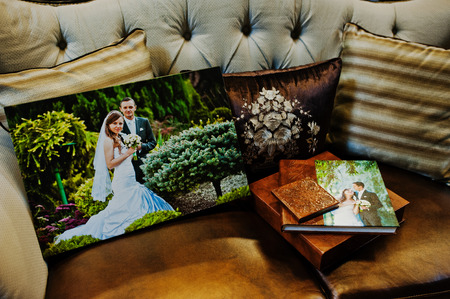 Brown leather wedding book and album with big picture on canvasの写真素材