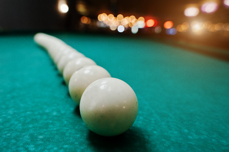 The russian billiards balls on the table in lineの写真素材