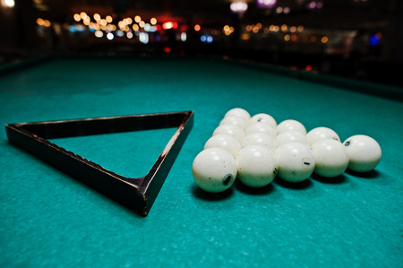 The russian billiards balls on the table with triangle