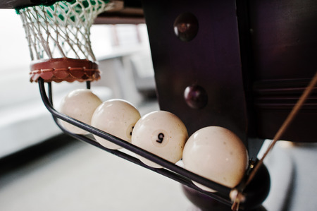 Pool billiards ball in the hole