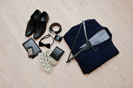 Men's casual outfits with accessories on light wooden backgroundの写真素材