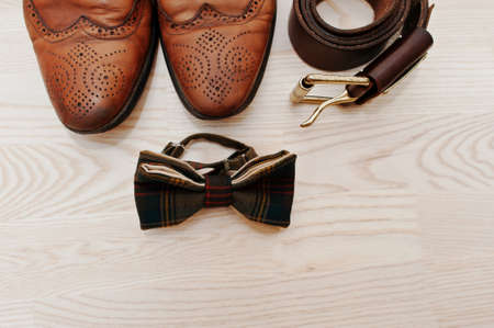 Men's casual outfits with accessories on light wooden backgroundの写真素材