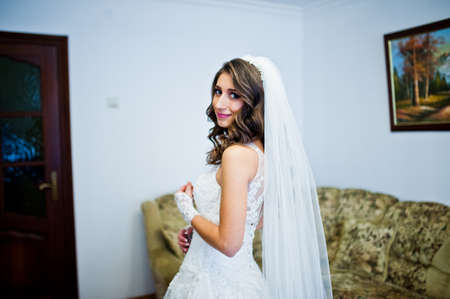 Portrait of cute curly bride at her roomの写真素材