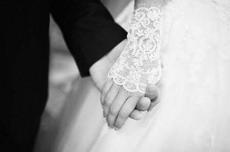 Black and white photo of close up hands of wedding coupleの写真素材