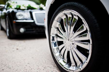 Stylish and cool chrome wheels on wedding carの写真素材