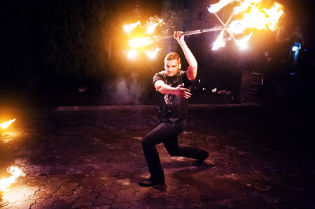 Presentable and awesome fire show at evening on wedding party.Photo with some noice