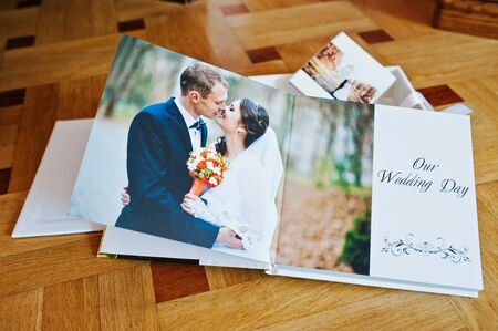 White leather wedding book or wedding album on wooden backgroundの写真素材