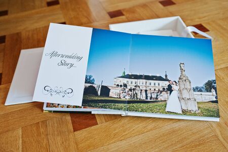 White leather wedding book or wedding album on wooden backgroundの写真素材