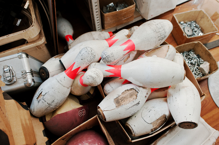 Broken wooden bowling pins in boxesの写真素材