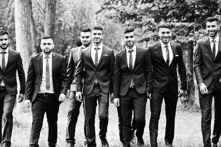 Kyiv, Ukraine - June 25, 2015: Eigth stylish arabic businessman mans in tuxedo, black and white photo.のeditorial素材