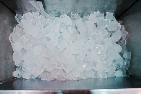 Many ice cubes on fridge at the barの写真素材