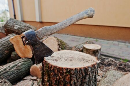 Axe in stump background chopped firewood.の写真素材