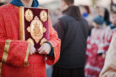 LVIV, UKRAINE - APRIL 27, 2016: Holy Week passion and death of Jesus Christ. Holy Gospel at handのeditorial素材