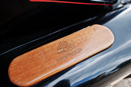 Podol, Ukraine - May 19, 2016: Logo on wood element of luxury retro car Maybach.