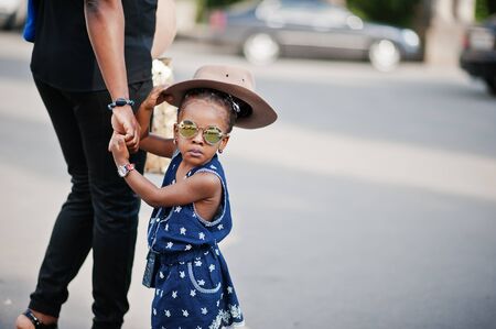 African american mother hold hand of daughterの写真素材