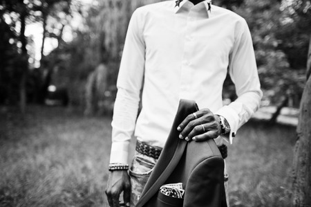 Close up portrait of stylish black man with jacket on handの写真素材