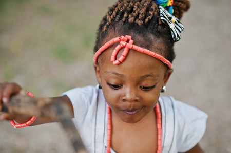 African baby girl walking at park