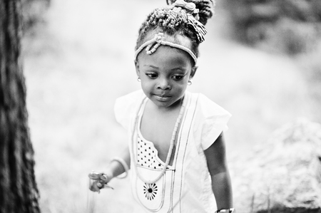 Amazing beautiful african american baby girl with sunglasses having funの写真素材