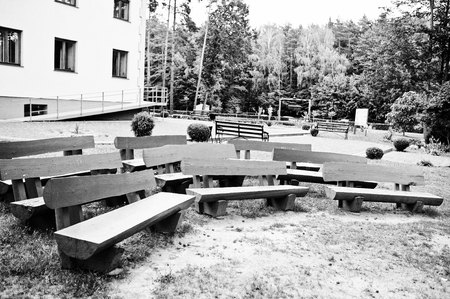 Row of wooden benches outdoor. Black and white photoの写真素材