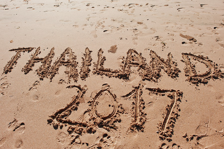 "Thailand 2017" written in the sand on the beachの写真素材