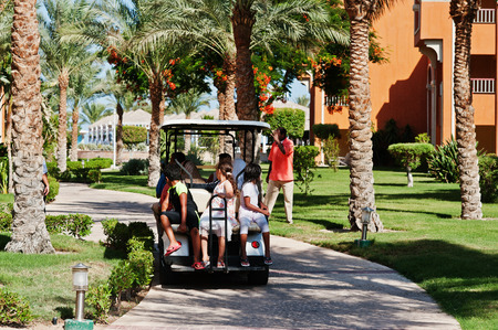 Hurghada, Egypt -20 August 2016: Arabian children sitting on small electric golf car in resortのeditorial素材