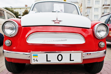 Tarnopol, Ukraine - October 09, 2016: Classic retro car dual color white & red  ZAZ Zaporozhets 965 designed and built from 1960-1963, with license plate LOLのeditorial素材