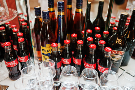 Hai, Ukraine - October 25, 2016: Coca Cola bottle with Metaxa cognac on buffet table