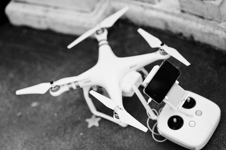 Hai, Ukraine - October 20, 2016: DJI Phantom IV Pro drone quadcopter with remote control and gadget