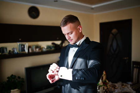 Man looking on luxury watches. Gathering of groom on wedding day.の写真素材